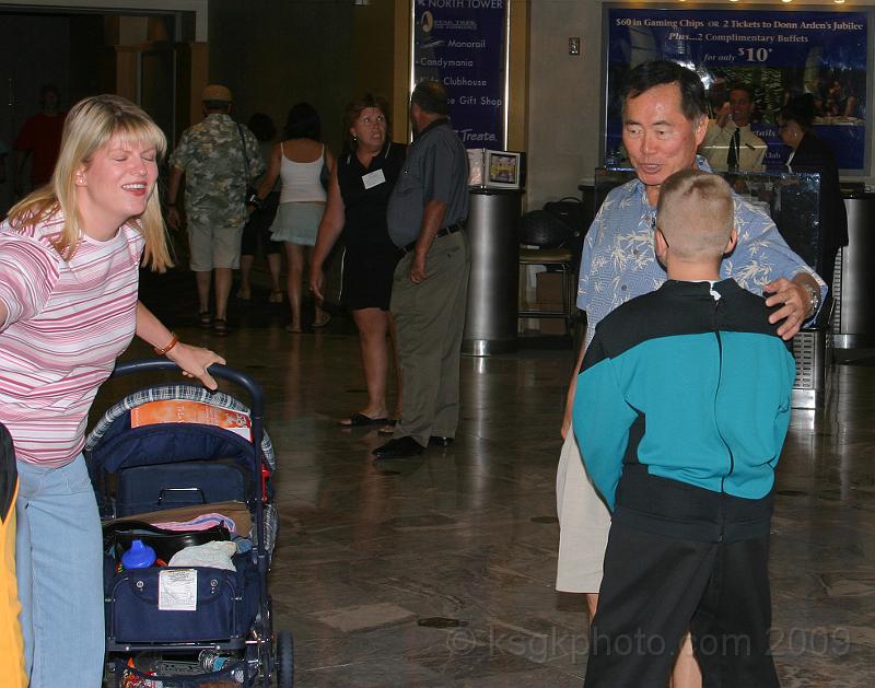 IMG_7853.jpg - A chance meeting in the Hilton Lobby, George Takei (TOS "Sulu") and Paul. Carlas blinking.. gonna miss it!